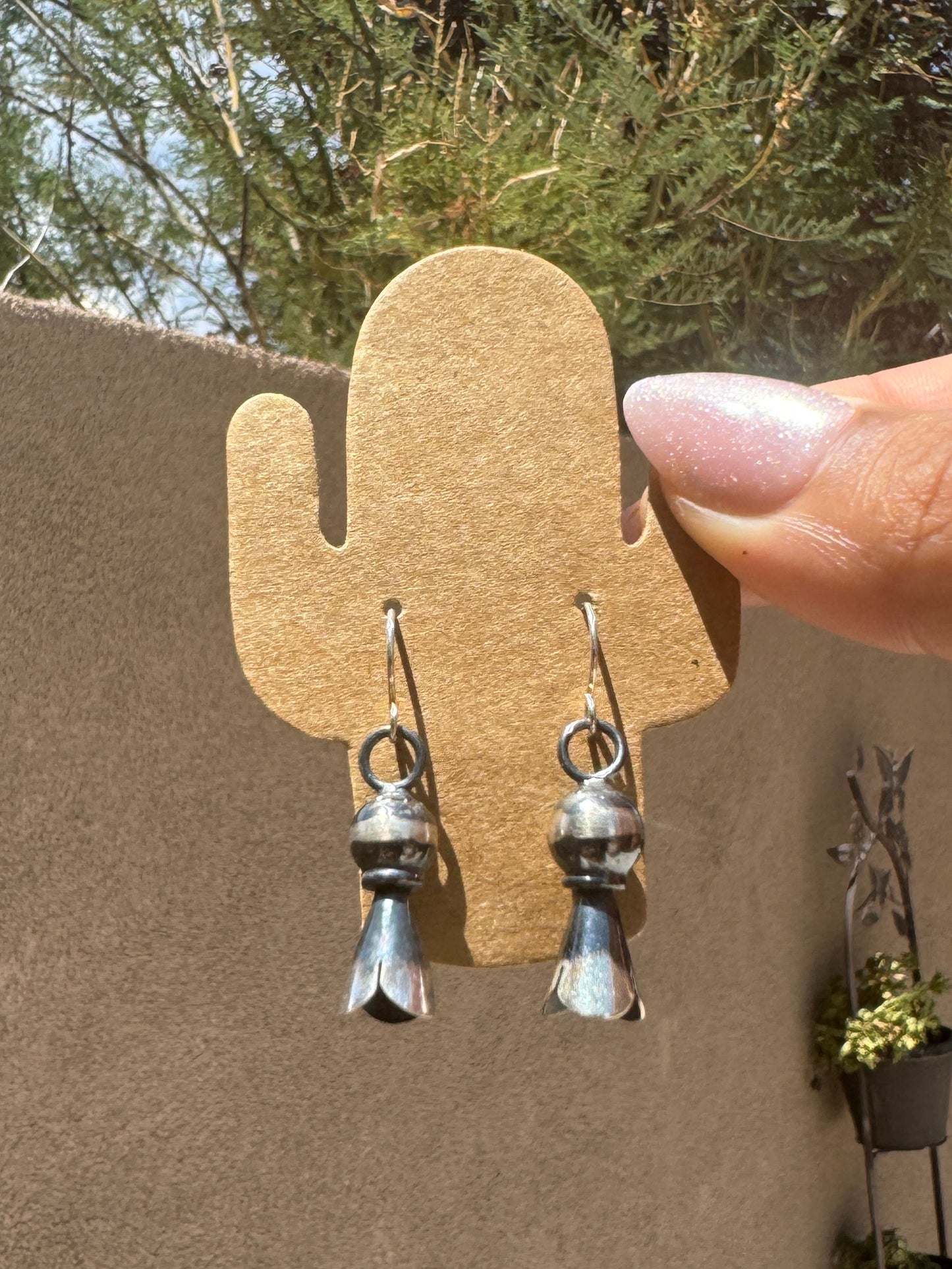 Silver blossom dangle earrings
