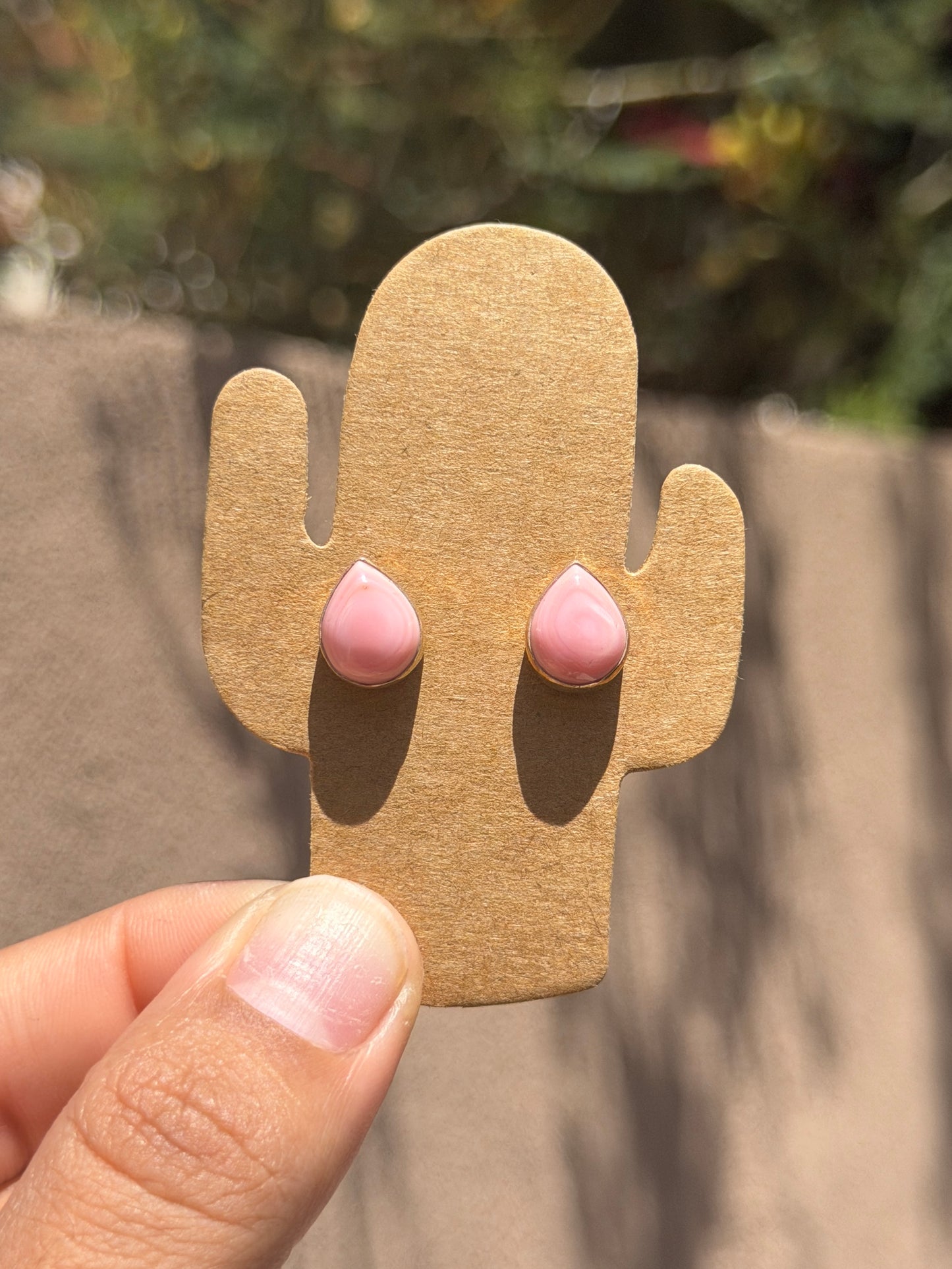Pink conch teardrop studs