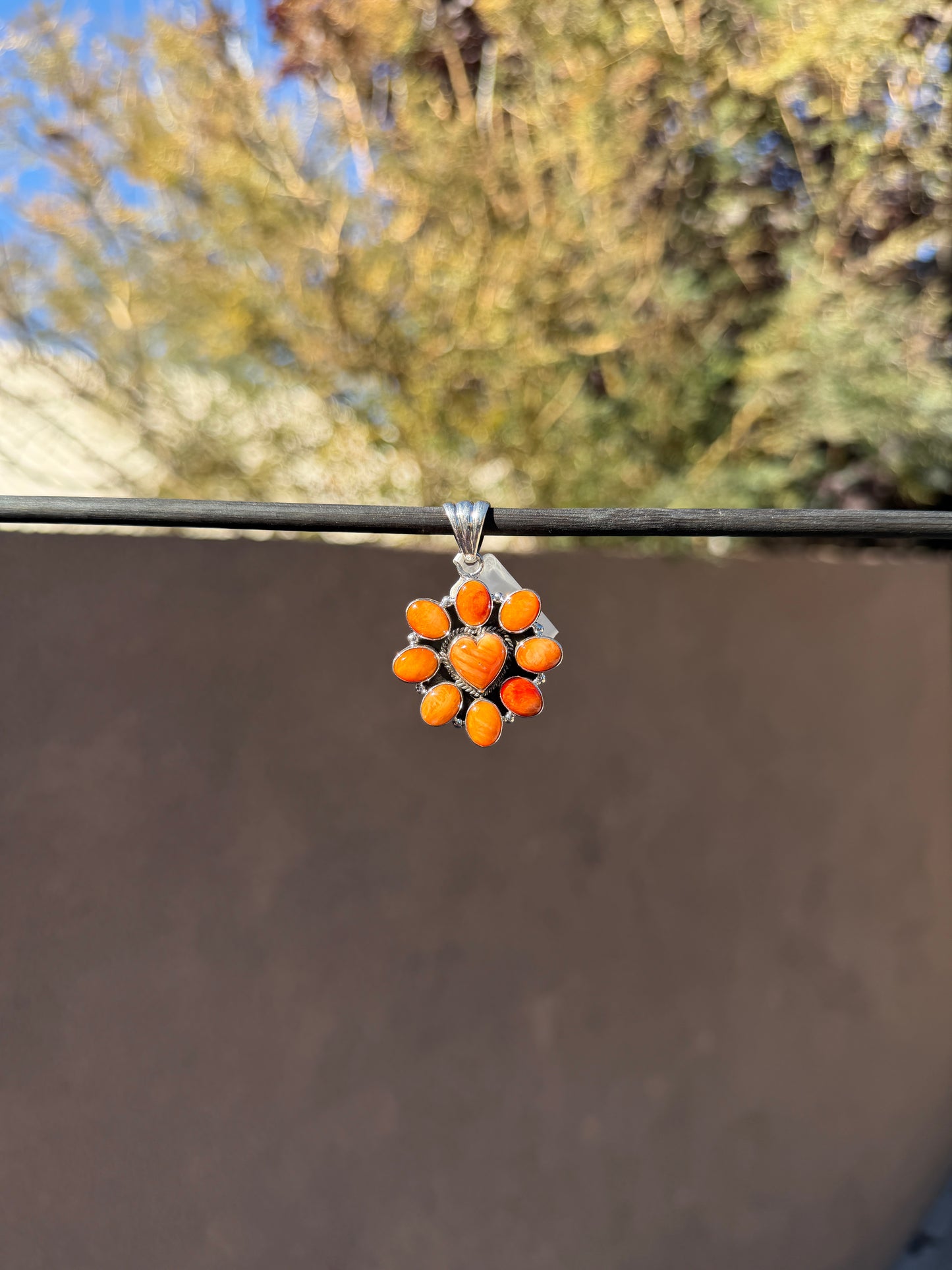 Orange spiny heart pendant