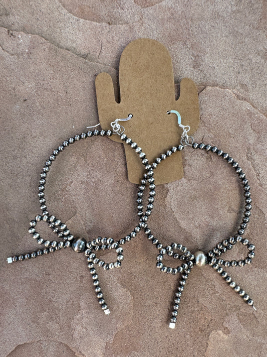 Silver pearl hoops with bow
