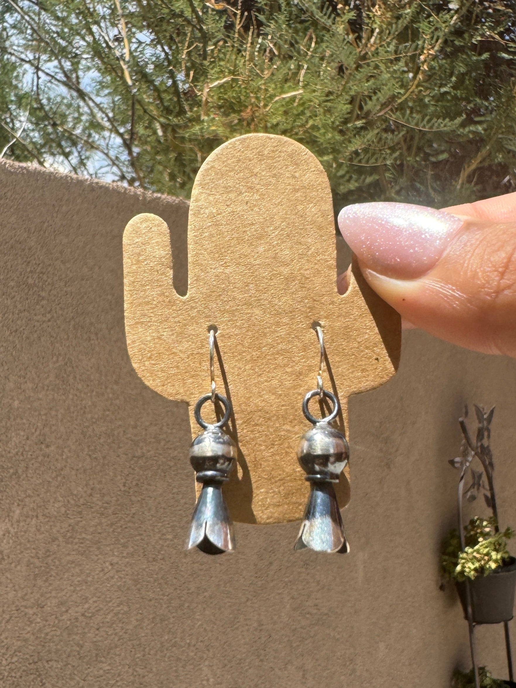 Silver blossom dangle earrings