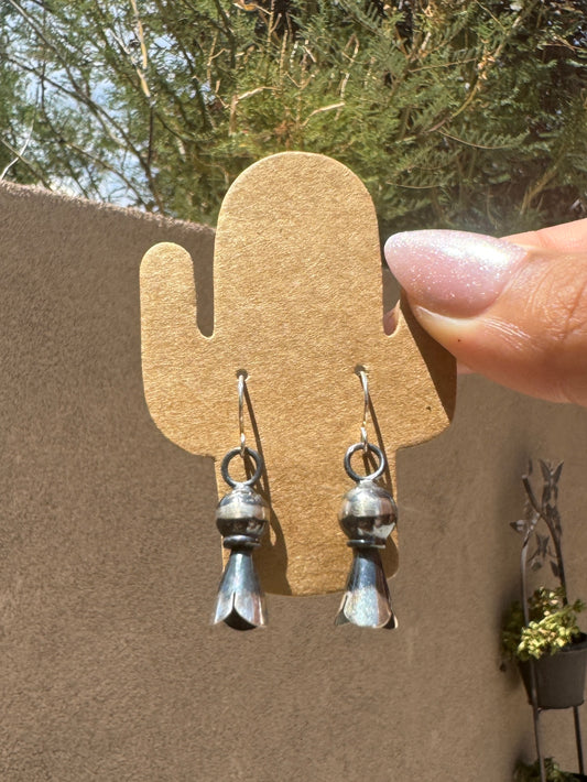 Silver blossom dangle earrings