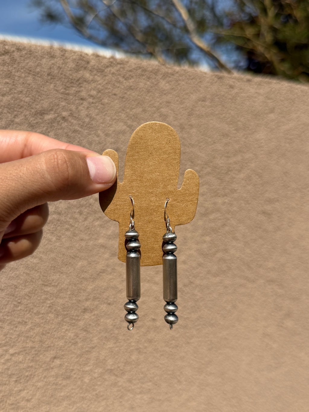 Native made saucer & barrel dangle earrings