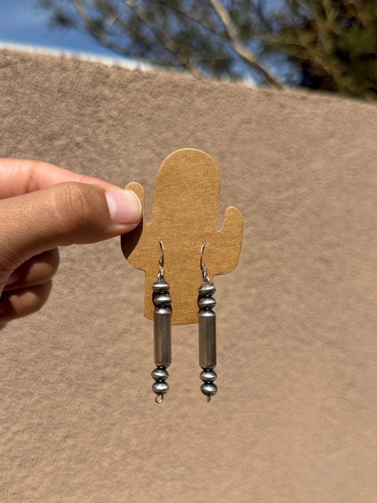 Native made saucer & barrel dangle earrings