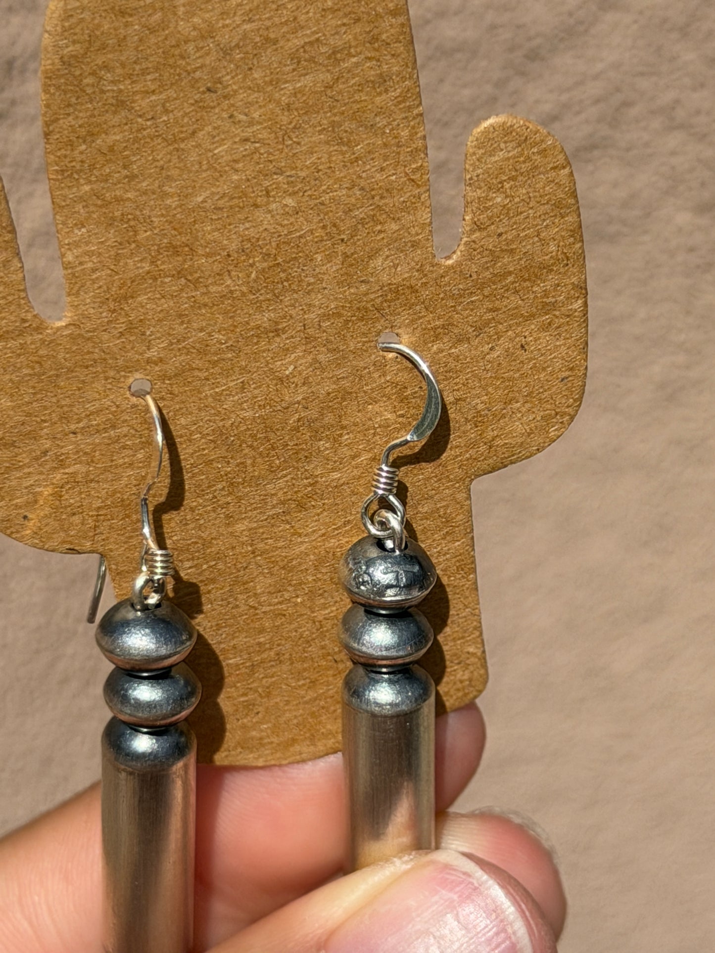 Native made saucer & barrel dangle earrings