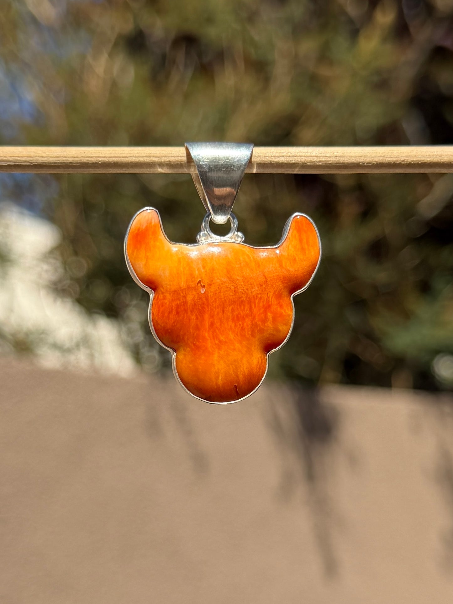 Orange Spiny cow head pendant
